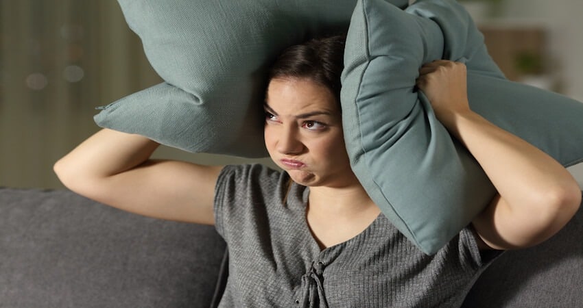 Angry woman suffering neighbour noise